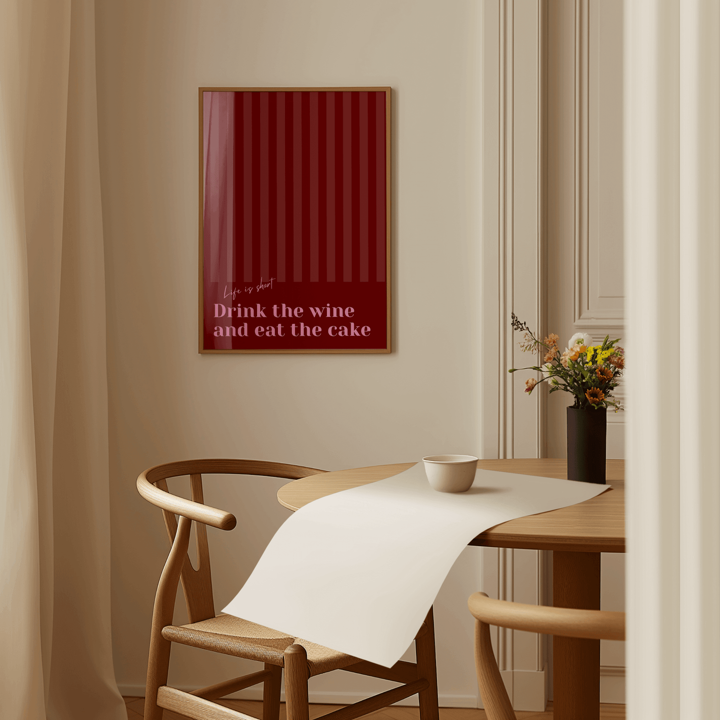 Red and pink typography print, in a wall hung frame featuring the quote "Life is short. Drink the wine and eat the cake"